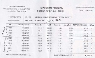 Copia del reporte de la Oficina de Administración Tributaria de Casa Grande donde se evidencia la deuda de Greco Quiroz a la comuna casagrandina